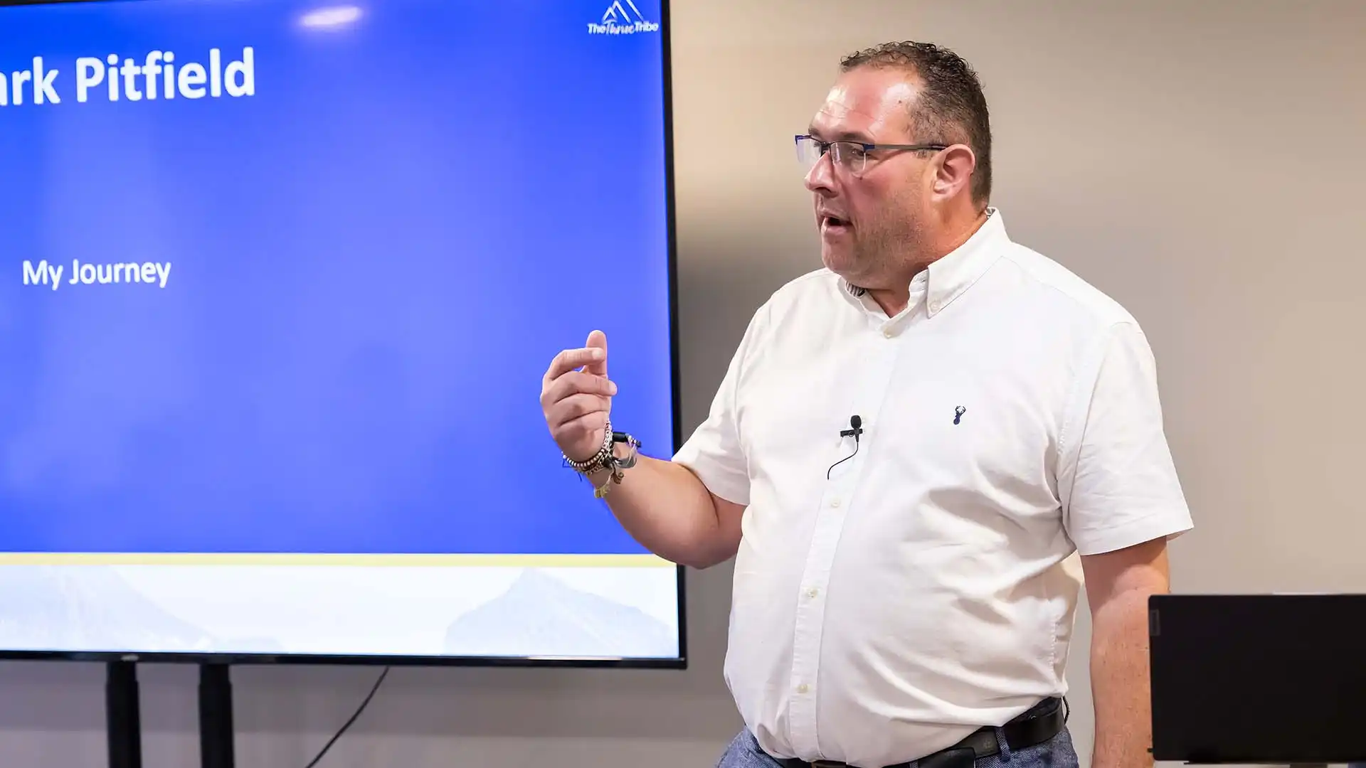 Mark giving meeting Business Coach at meeting